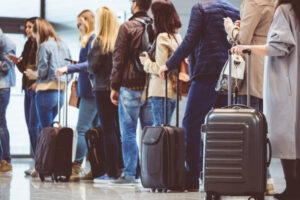 Travelers waiting in line at an airport 